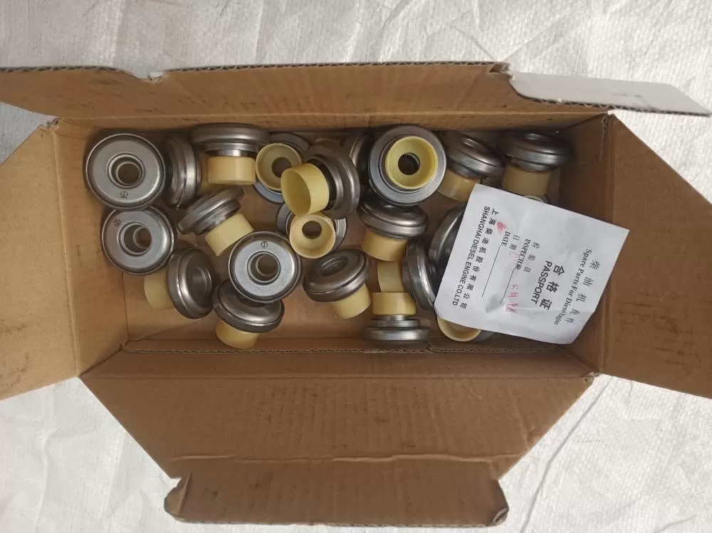 Rotating spring seat and oil cover components 